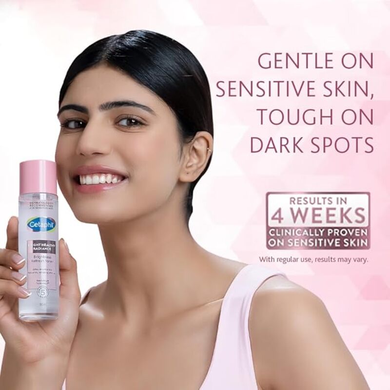 Women holding the product on light pink background