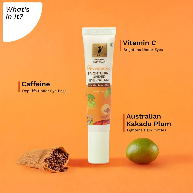 A tube of PILGRIM 4% VITAMIN C BRIGHTENING UNDER EYE CREAM with product information and branding visible on orange background 