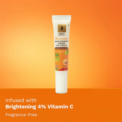 A tube of PILGRIM 4% VITAMIN C BRIGHTENING UNDER EYE CREAM with product information and branding visible on orange background