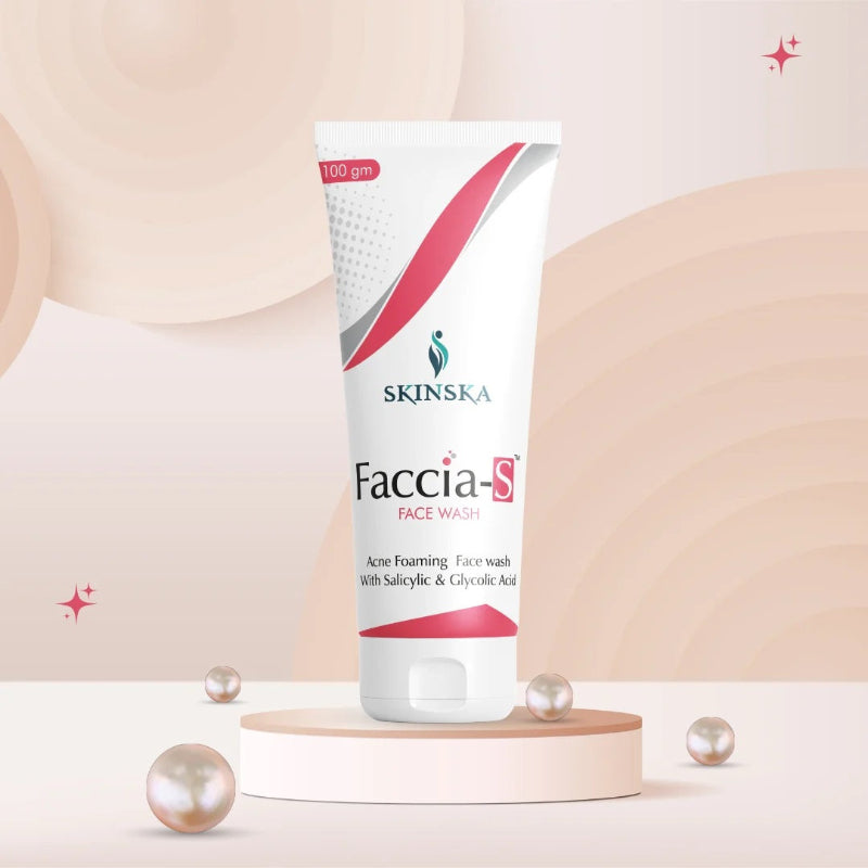 A tube of FACCIA-S FACE WASH by Skinska, presented on a pedestal with decorative pearls around it, against a soft gradient background.