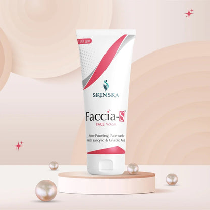 A tube of FACCIA-S FACE WASH by Skinska, presented on a pedestal with decorative pearls around it, against a soft gradient background.