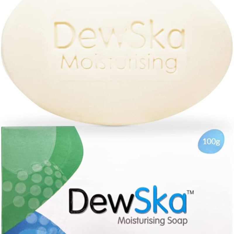 A bar of DewSka moisturizing soap with packaging indicating 100g weight, predominantly white with green accents and text.