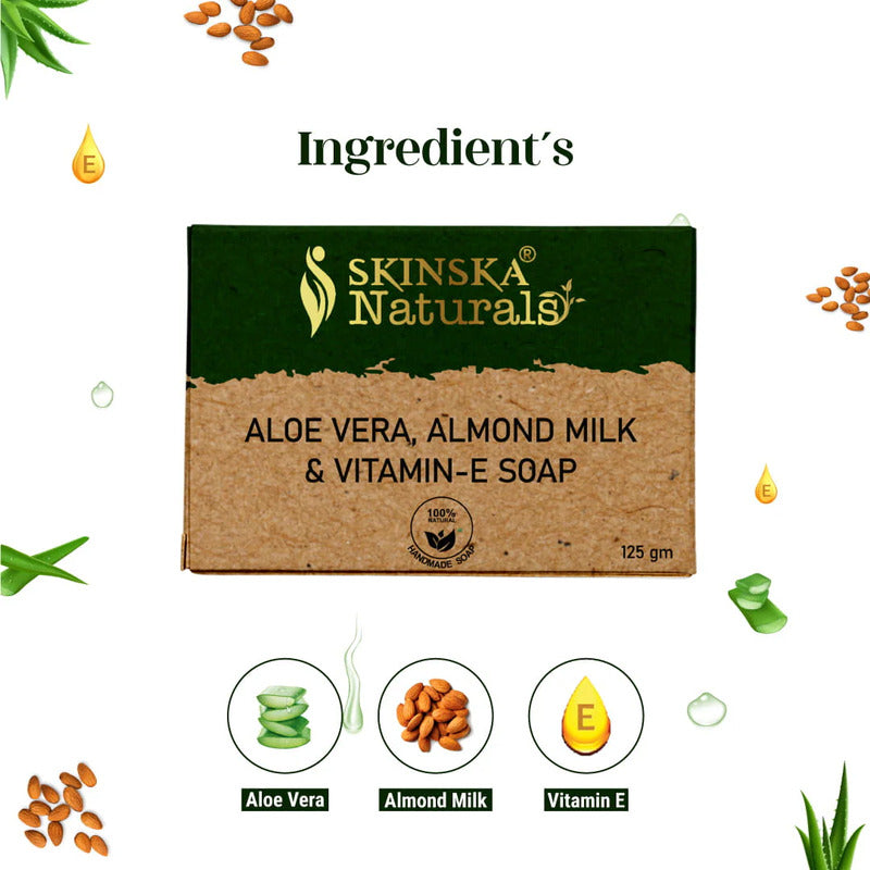 Soap bar with aloe vera, almond milk, and vitamin E ingredients displayed around it.