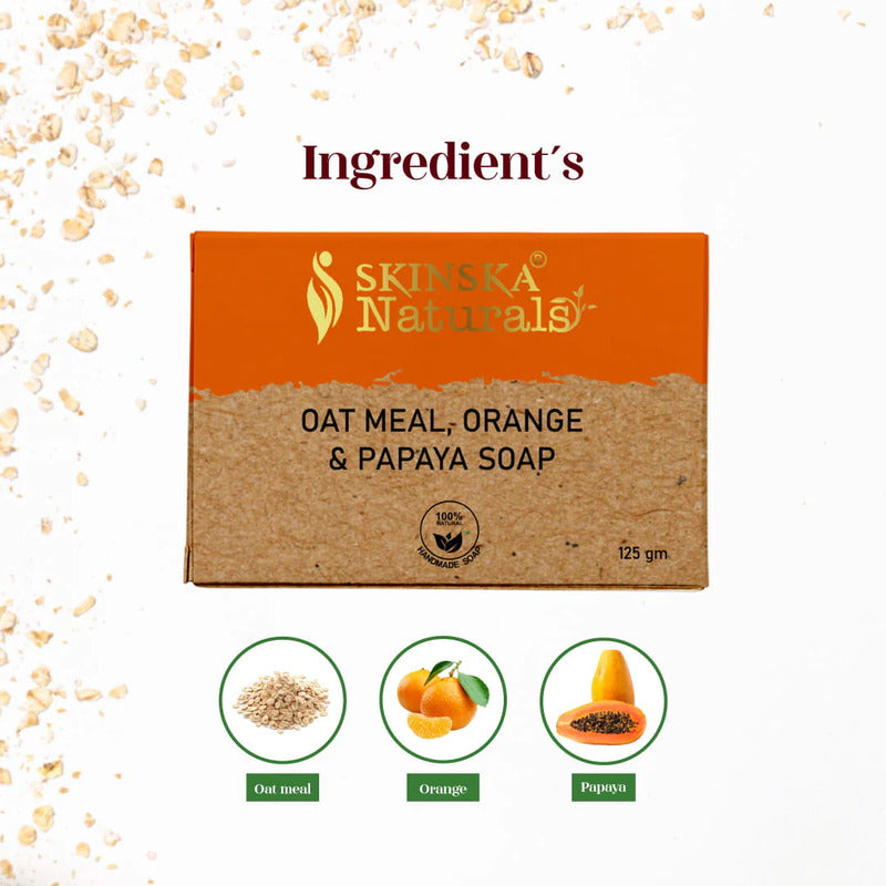 Soap package with ingredients oats, orange, and papaya on a light background.